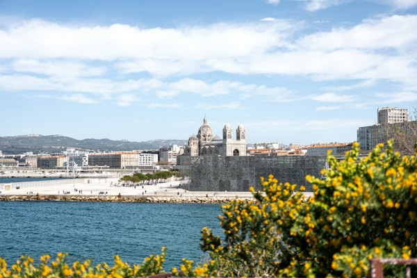 A large body of water with a city in the background — Marseille, France
