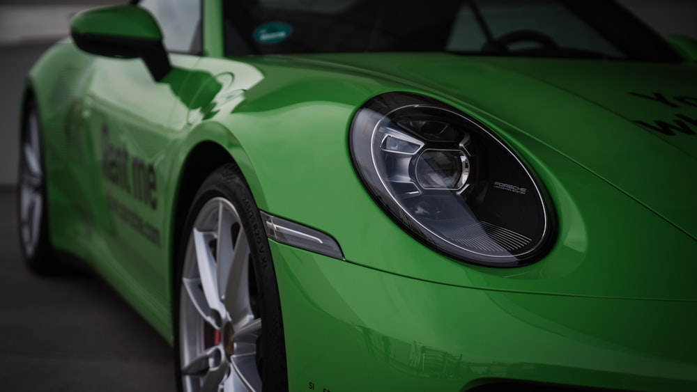 a close up of a green sports car