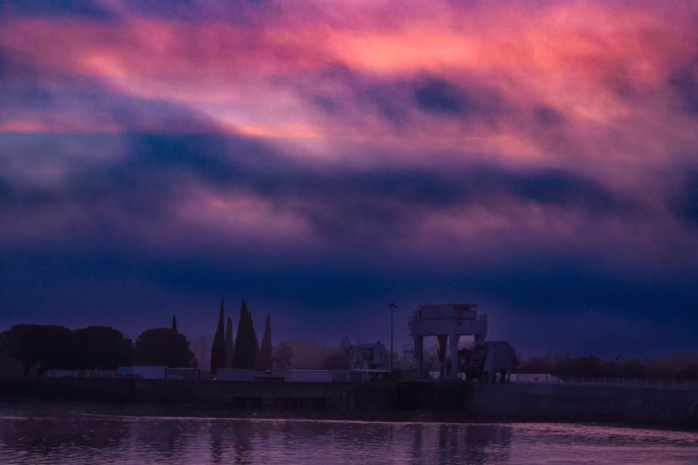 a large body of water under a cloudy sky