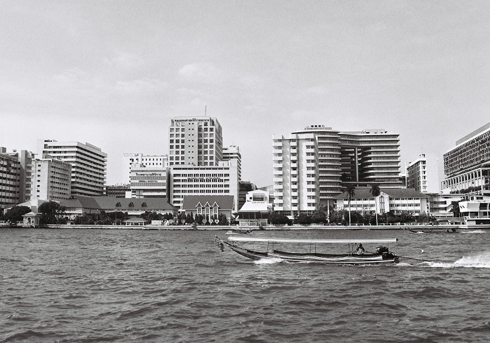 a black and white photo of a boat in the water