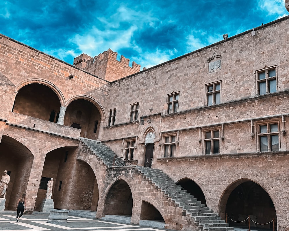 a stone building with a staircase leading up to it