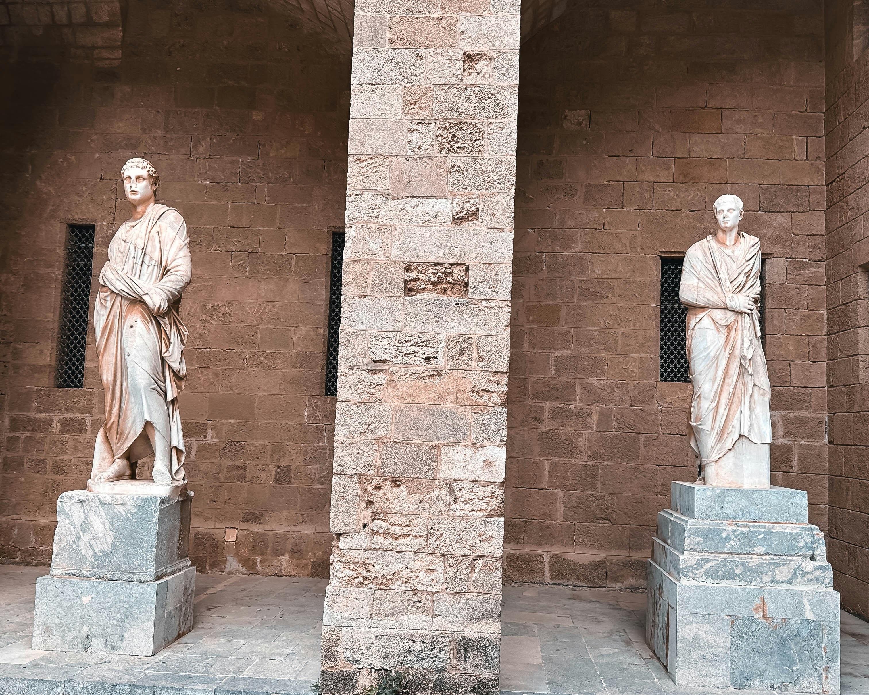 a couple of statues sitting next to each other