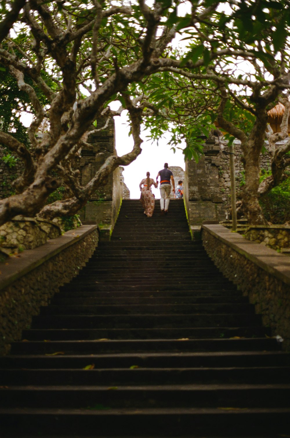 a group of people walking down a set of stairs