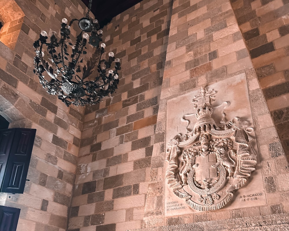 a chandelier hanging from the side of a building