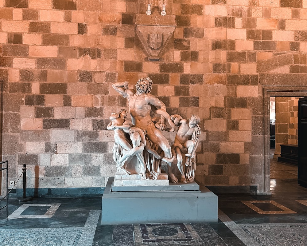 a statue of a group of people in a room