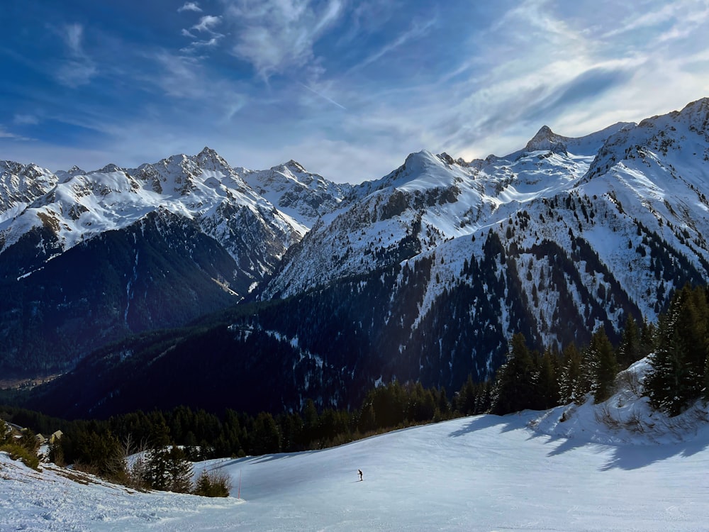 a person skiing down a snow covered mountain