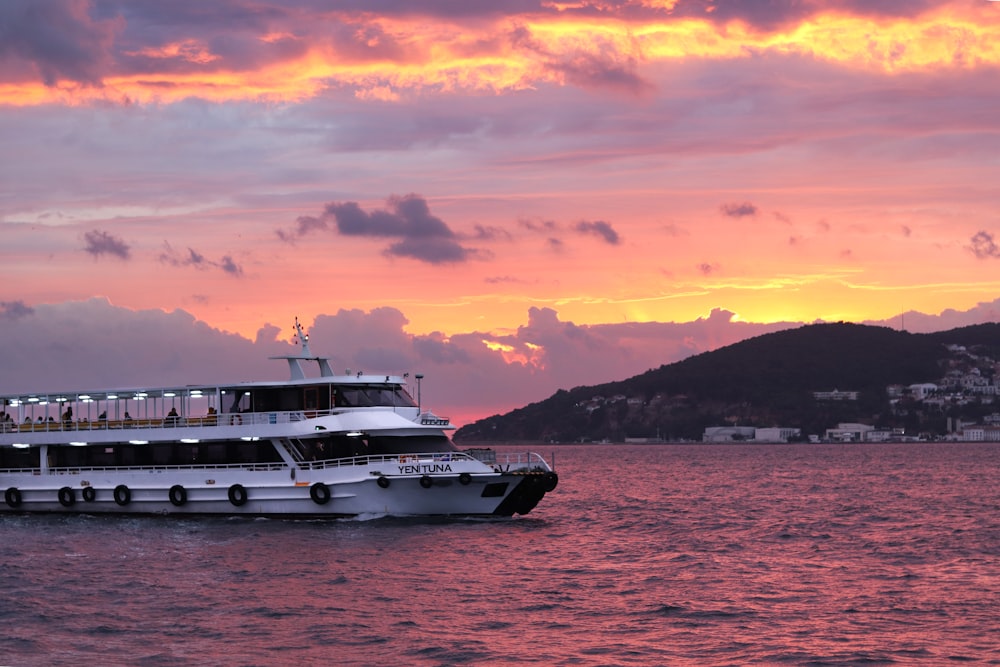 a large boat floating on top of a body of water