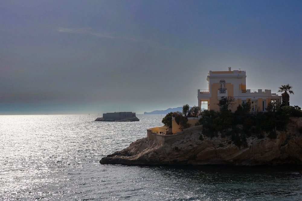 a house on an island in the middle of the ocean