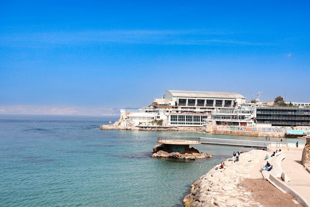 a body of water with buildings in the background