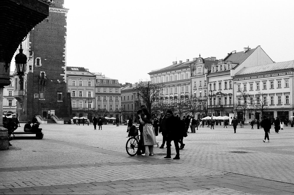 a black and white photo of a city square