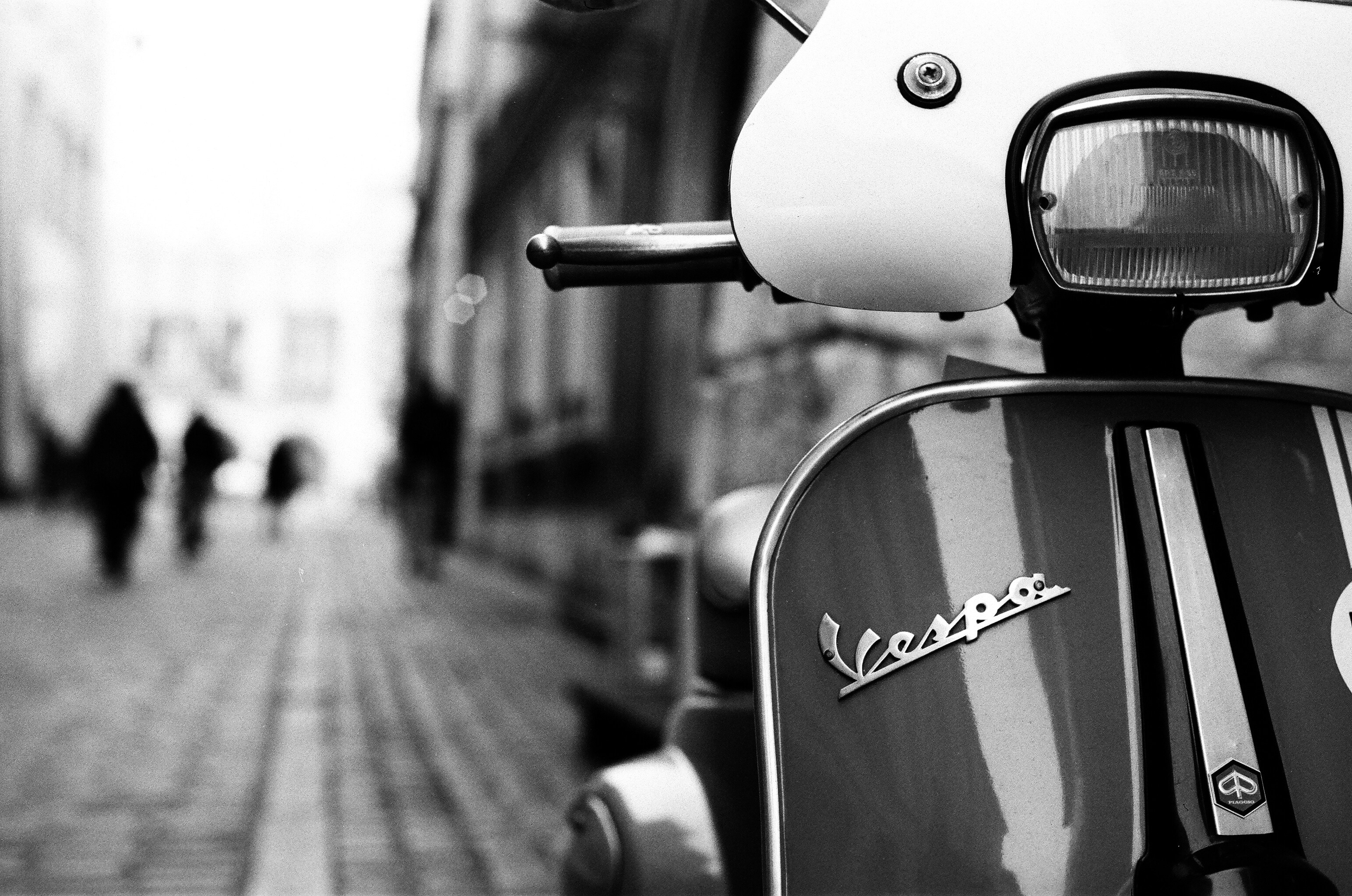 a scooter parked on the side of a street