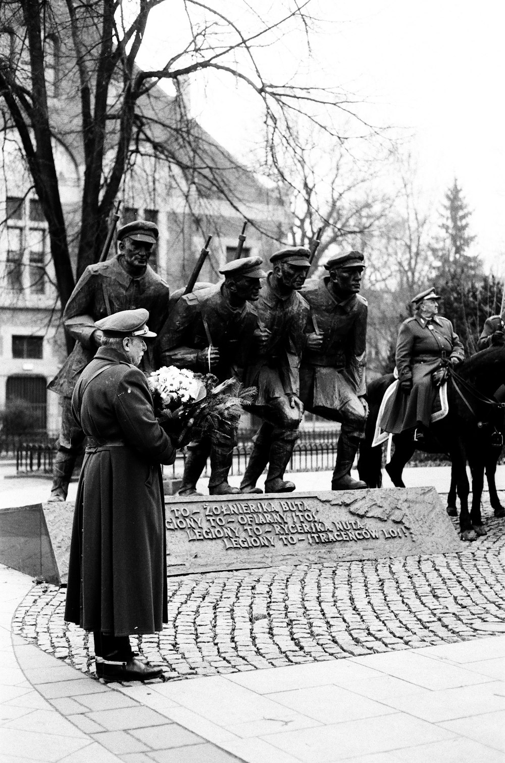 a group of people standing around a statue