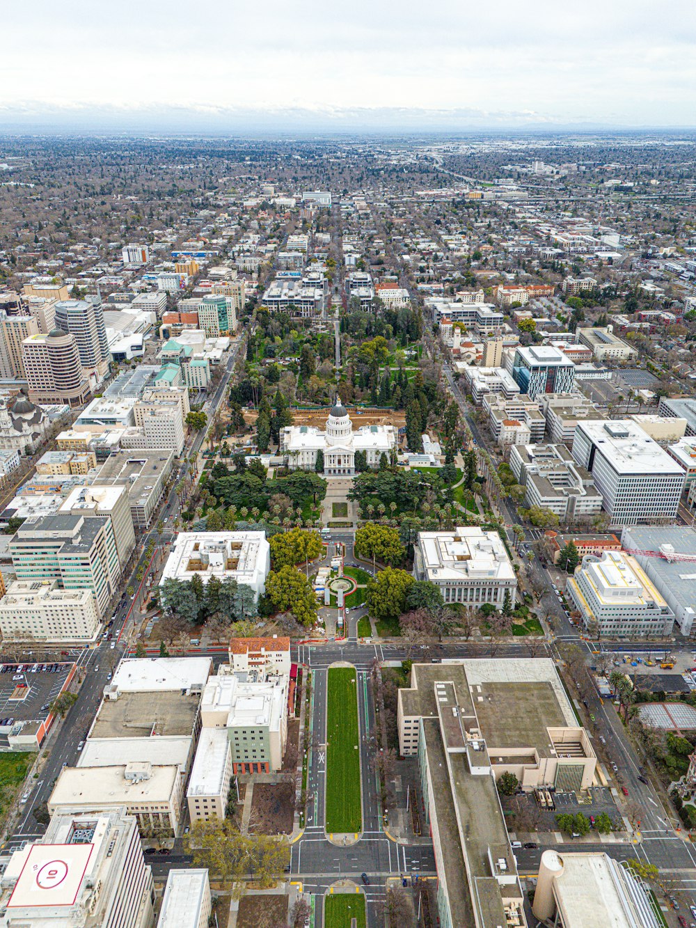 an aerial view of a city with lots of tall buildings