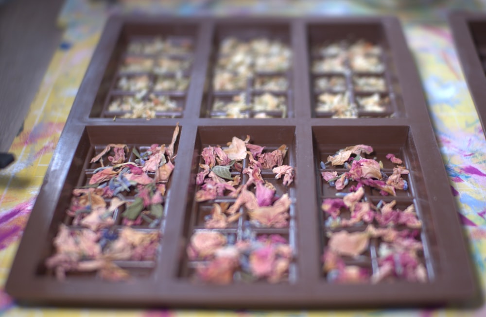 a chocolate tray filled with different types of candies