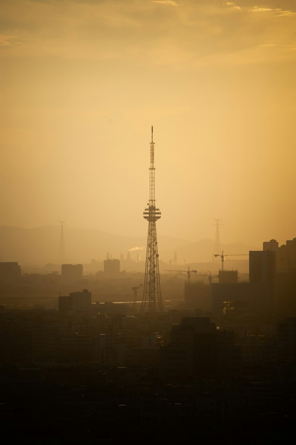 a very tall tower in the middle of a city