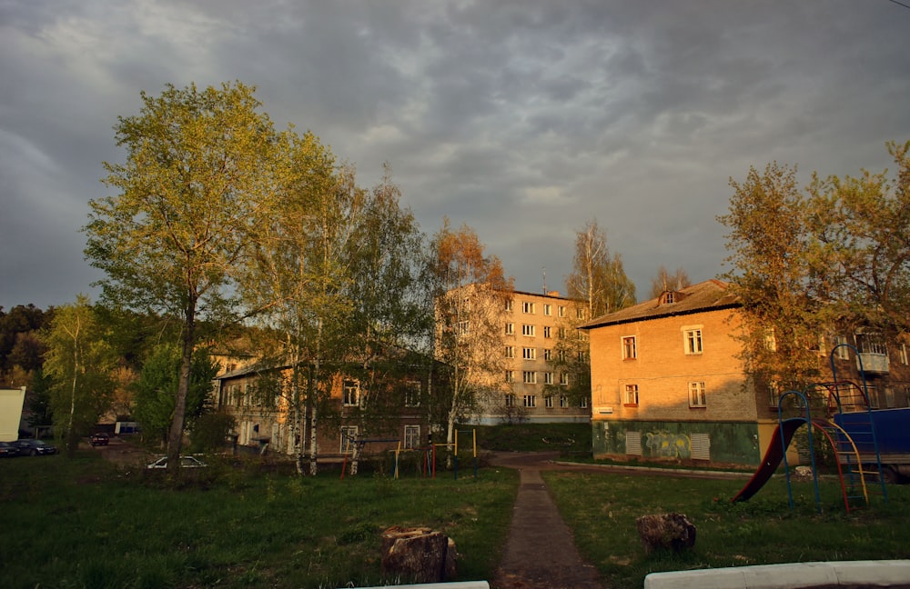 a large building with a playground in front of it