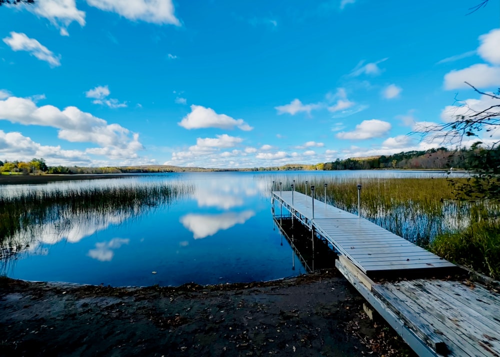 a wooden dock sitting next to a body of water