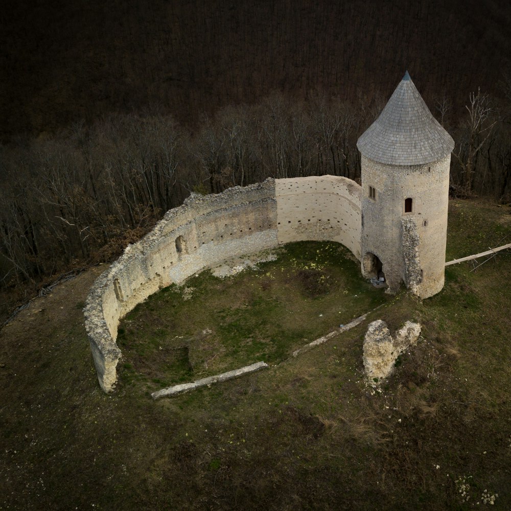 an aerial view of a castle in the middle of a field