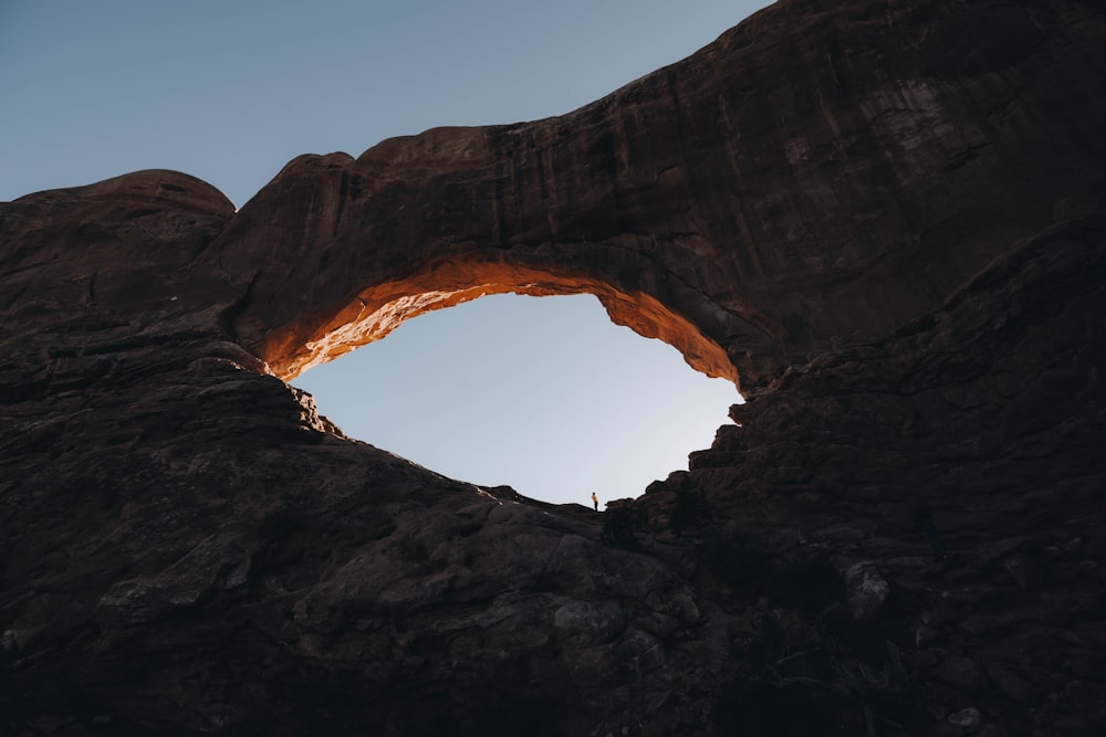 a rock formation with a hole in the middle