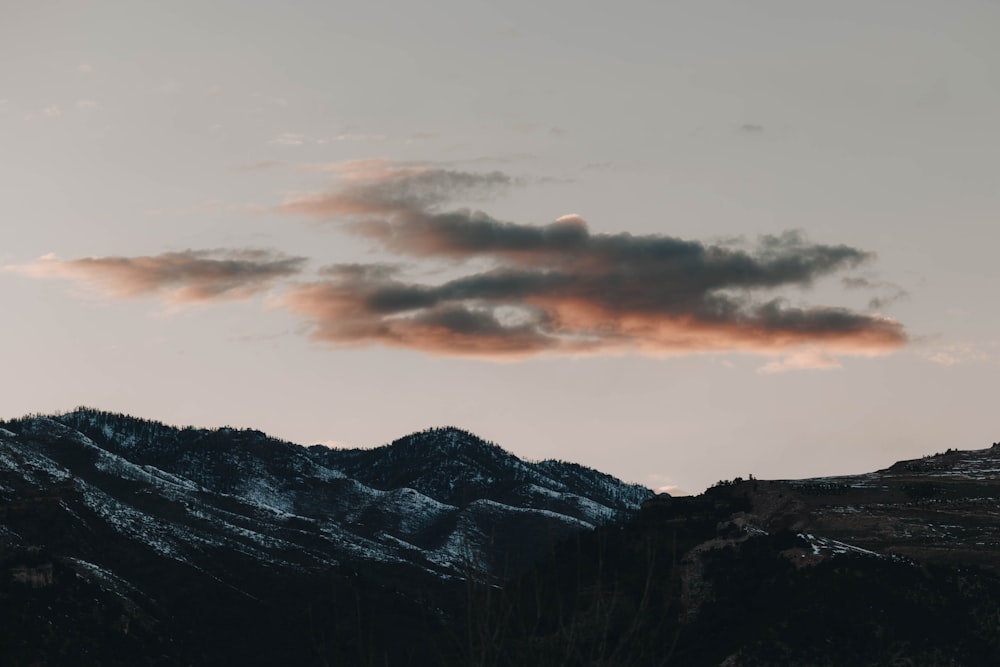 a couple of mountains that are covered in snow