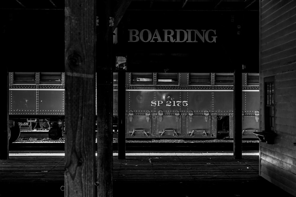 a black and white photo of a train at a train station