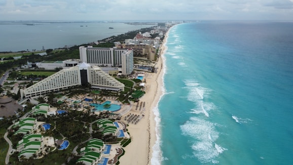 an aerial view of a resort and beach