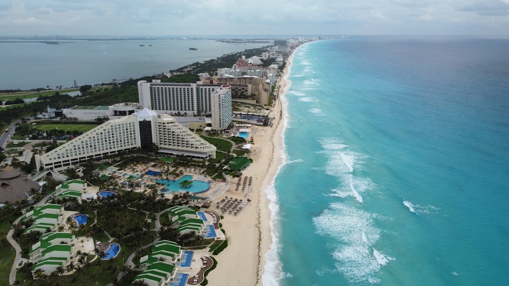 an aerial view of a resort and beach