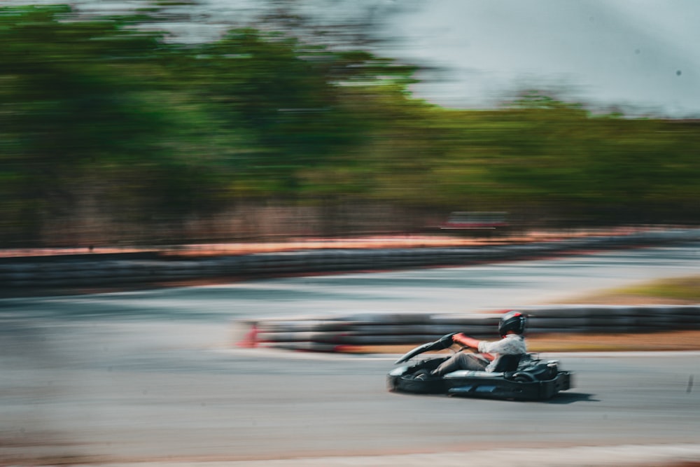 a person riding a motorcycle on a race track