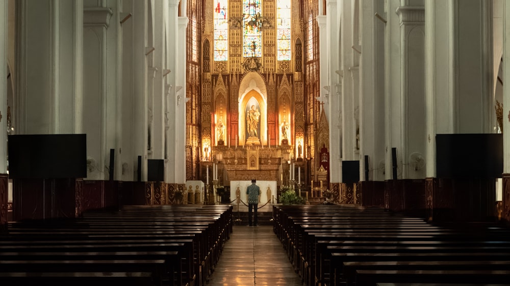 a church with pews and stained glass windows