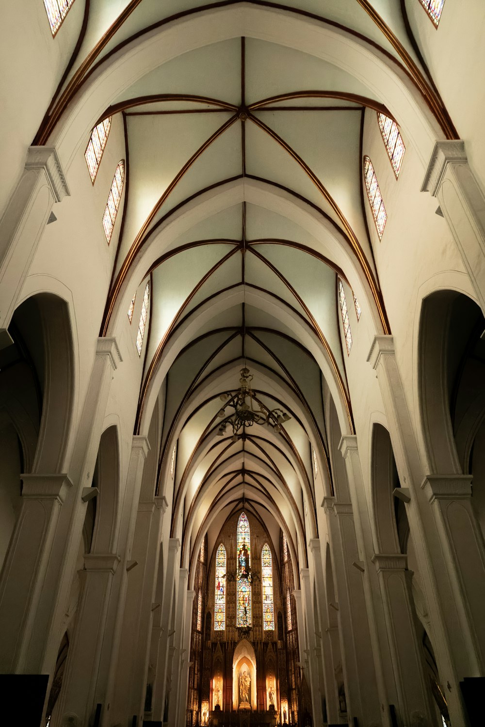 a large cathedral with high vaulted ceilings and stained glass windows