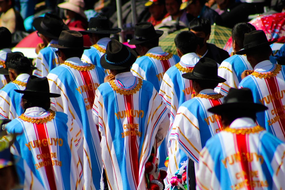 a large group of people dressed in colorful clothing