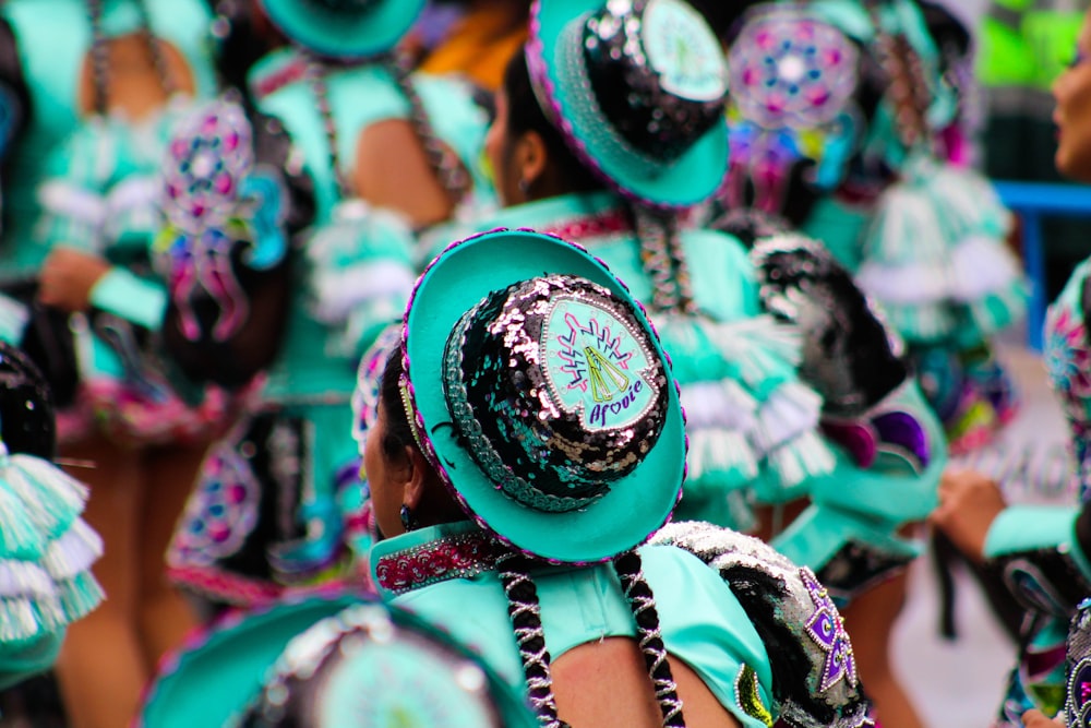 a group of people in colorful costumes and hats