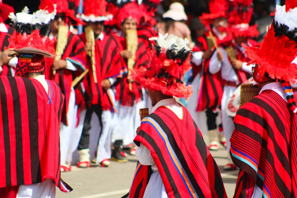 a group of people in red and black costumes