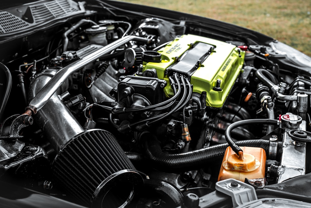 the engine compartment of a car with a yellow engine