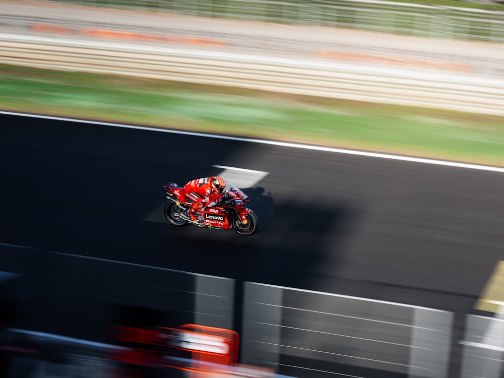 a person riding a motorcycle on a race track