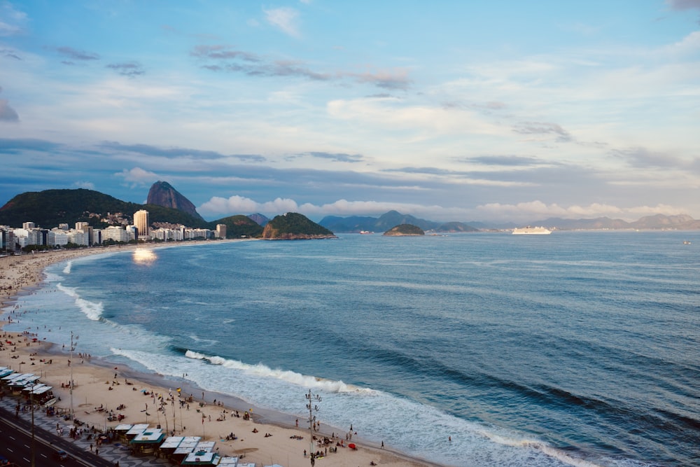 a view of a beach with a city in the background