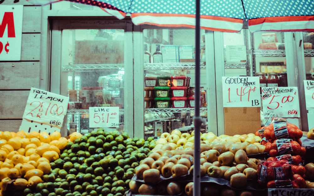 a fruit stand with a variety of fruits and vegetables