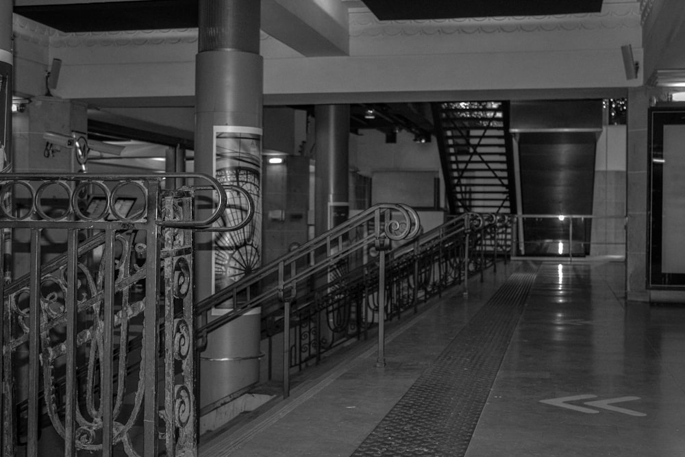 a black and white photo of a staircase in a building