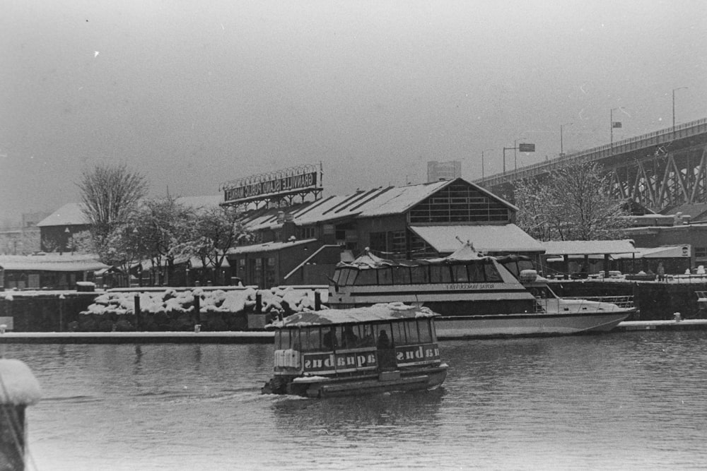 a black and white photo of a boat in the water