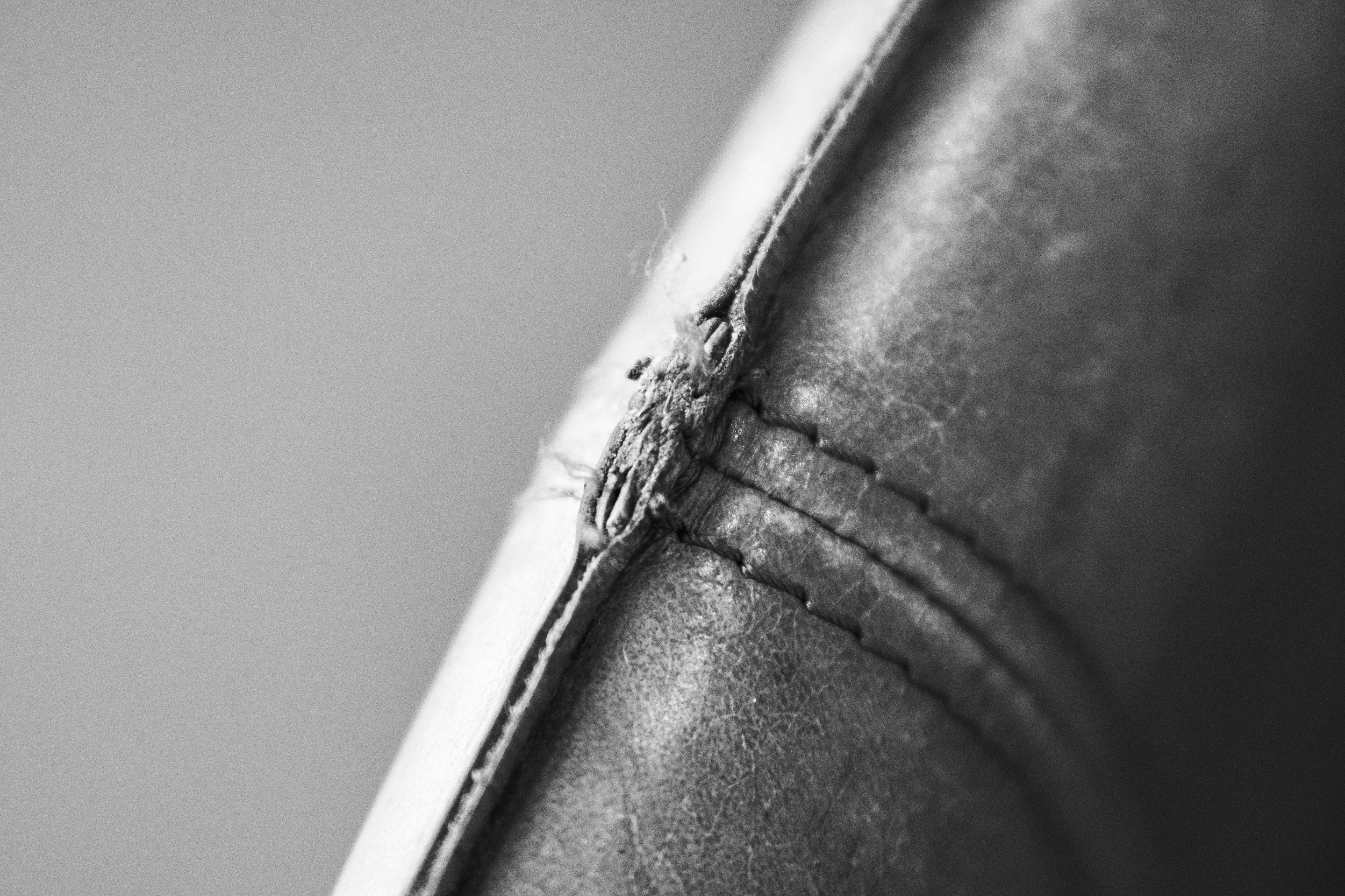 a black and white photo of a piece of leather