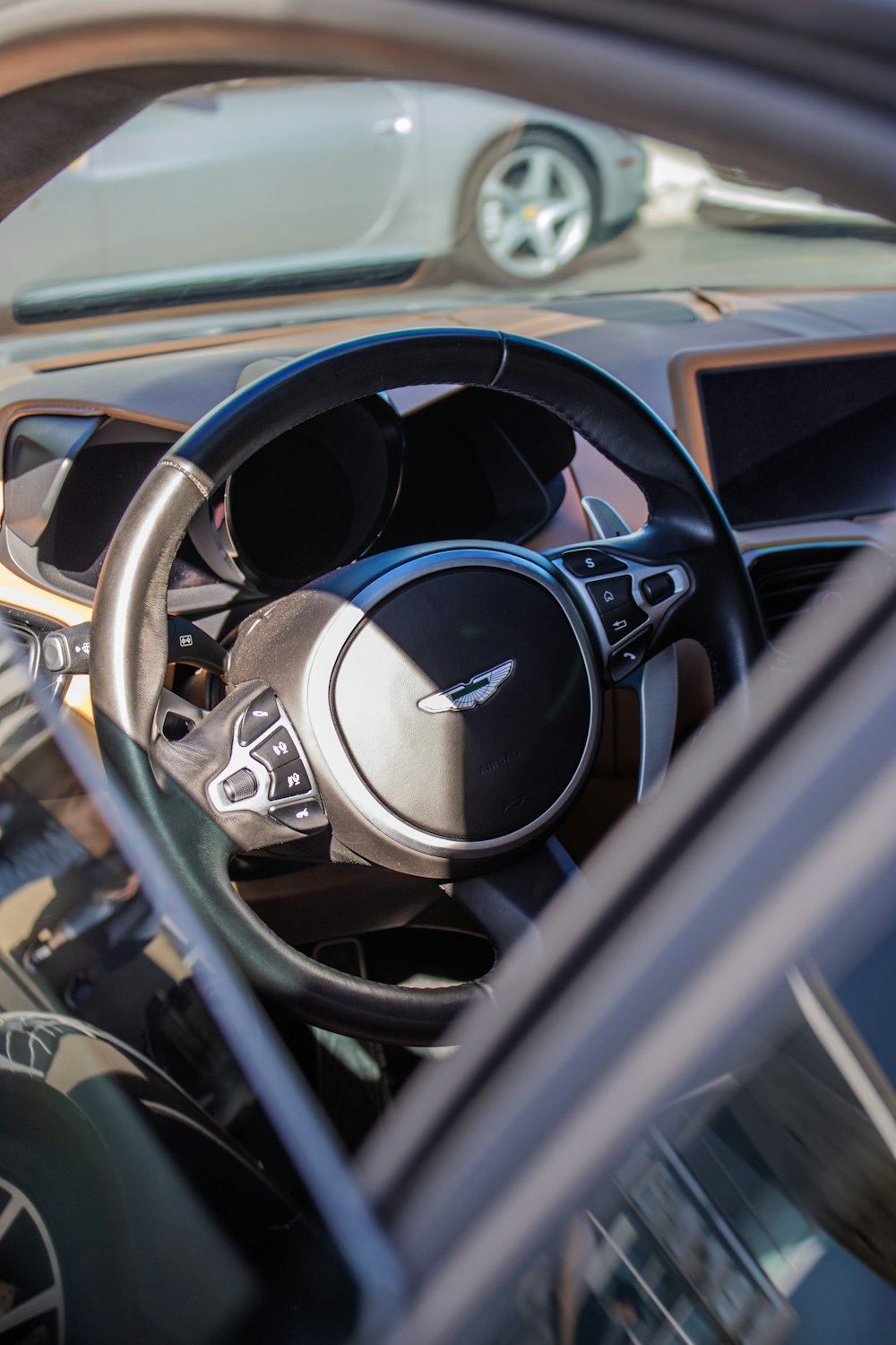 the interior of a car with a steering wheel