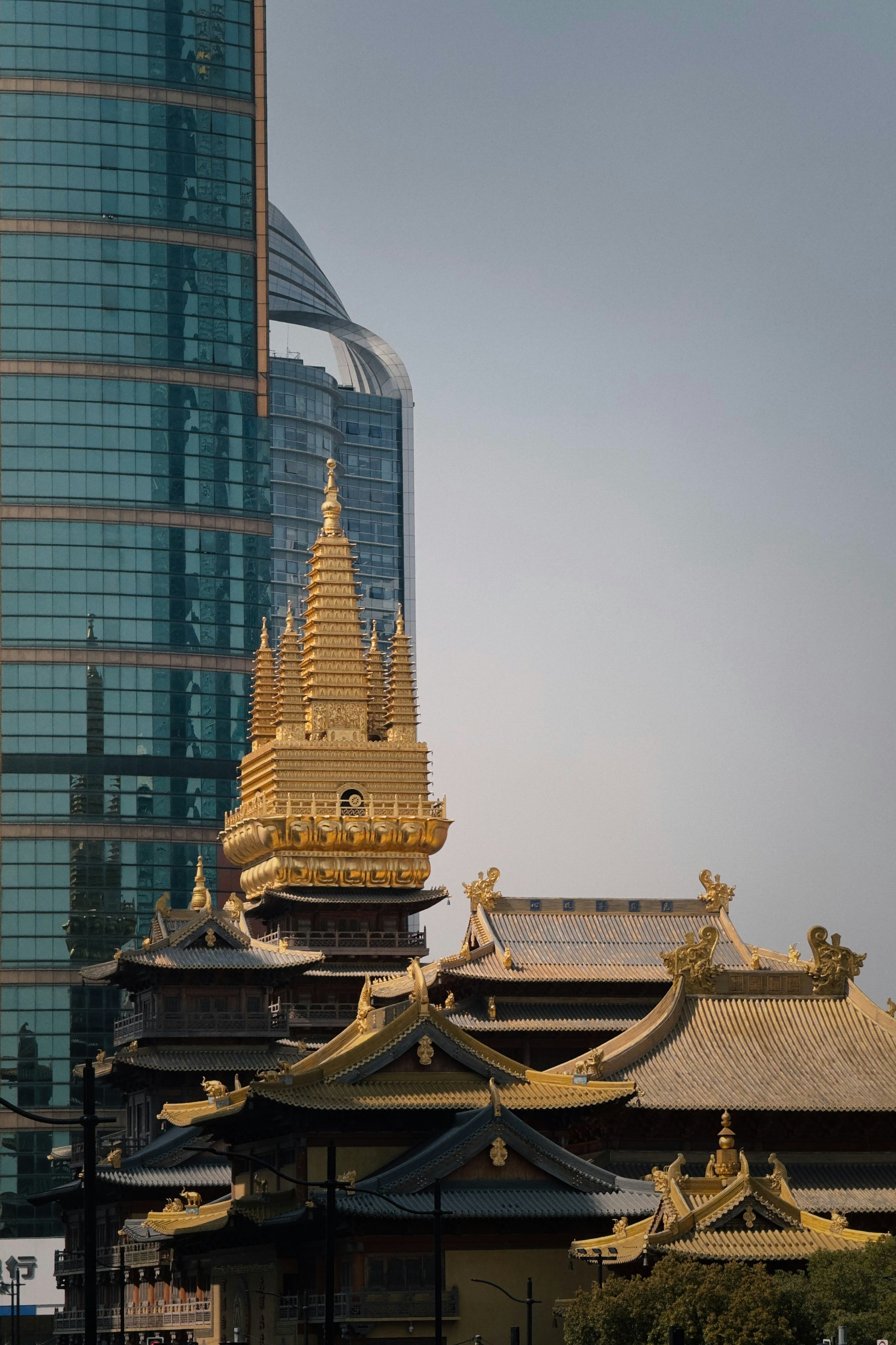 a tall building with a clock tower in the background