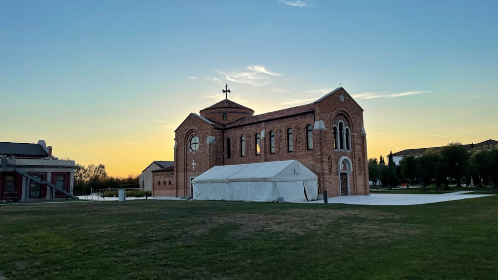 a church with a white tent in front of it