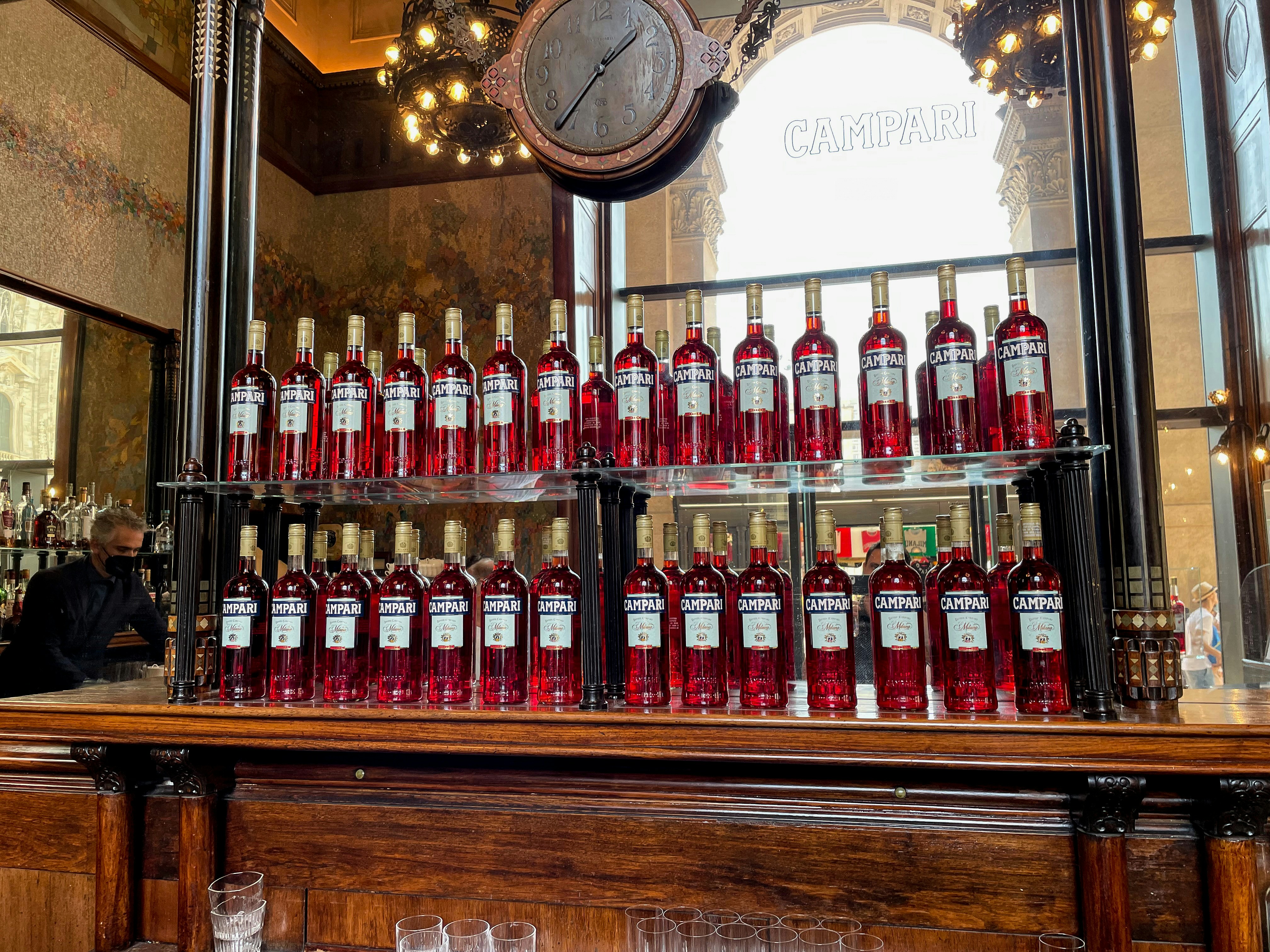 a display case filled with lots of bottles of wine