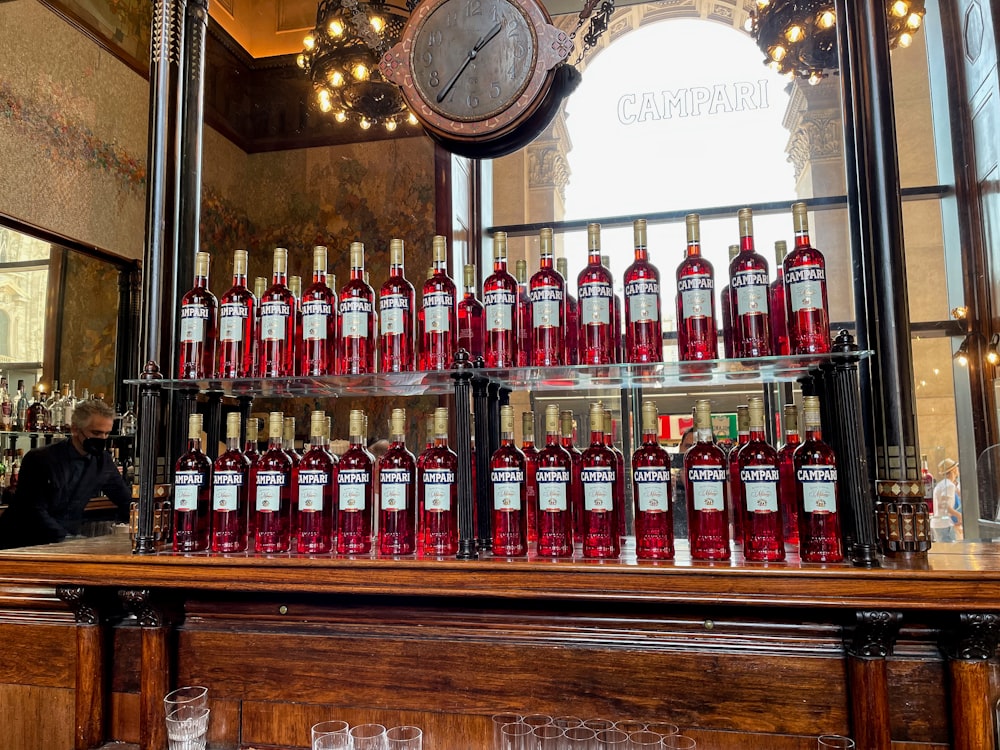 a display case filled with lots of bottles of wine