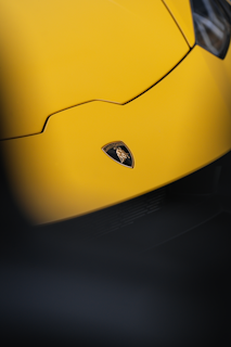 a close up of a yellow sports car