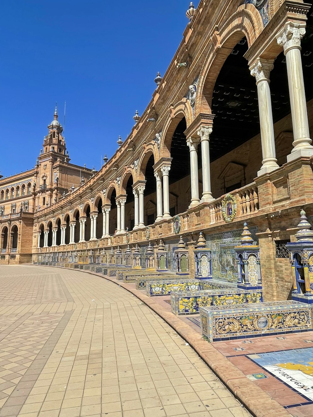 a large building with a clock tower in the background