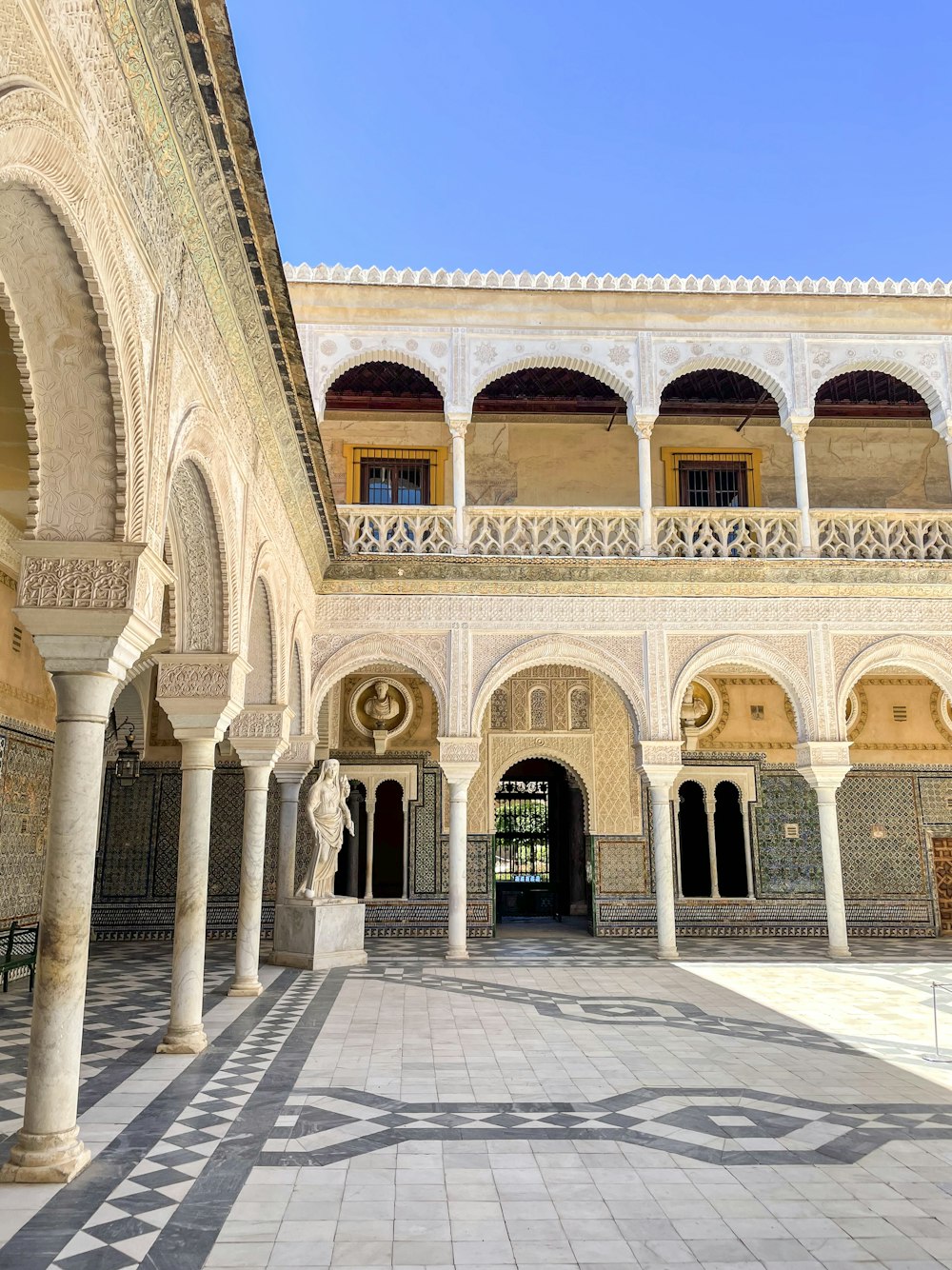 a large building with columns and arches