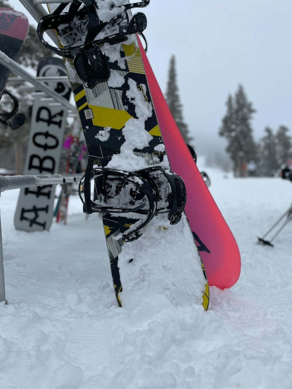 a pair of snowboards sticking out of the snow