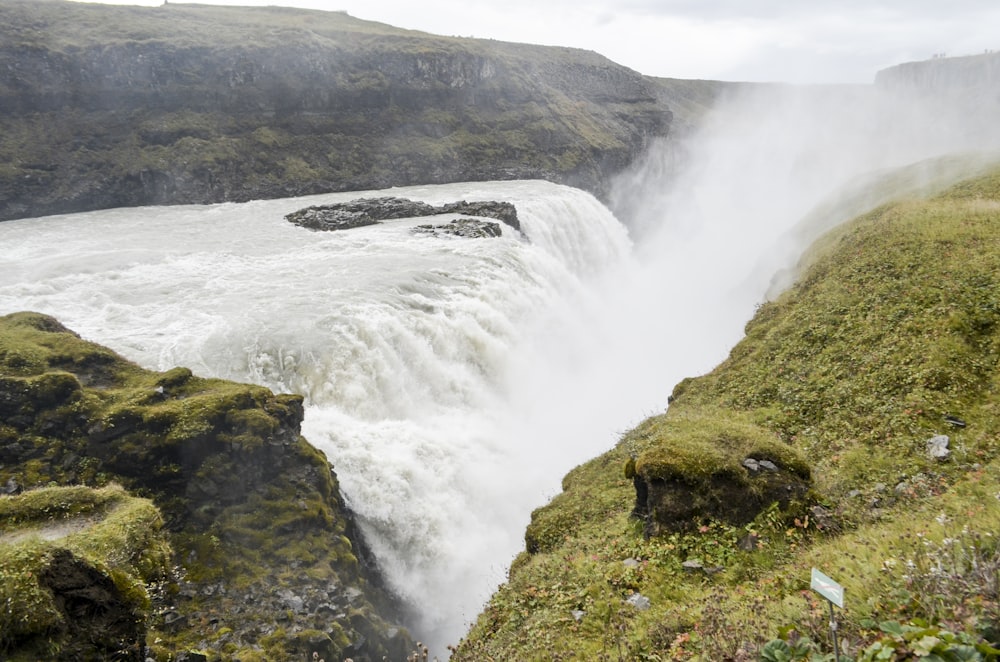 a large waterfall with water coming out of it